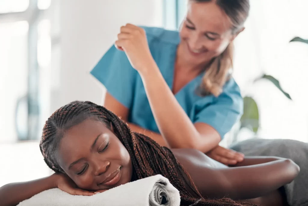 black-woman-bed-and-smile-for-spa-back-massage